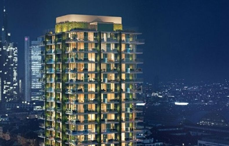 NOVIA: Projekt Eden Tower in Frankfurt am Main (Außenansicht des beleuchteten Gebäudes bei Nacht vor Frankfurter Skyline - quadratisches Bildformat)